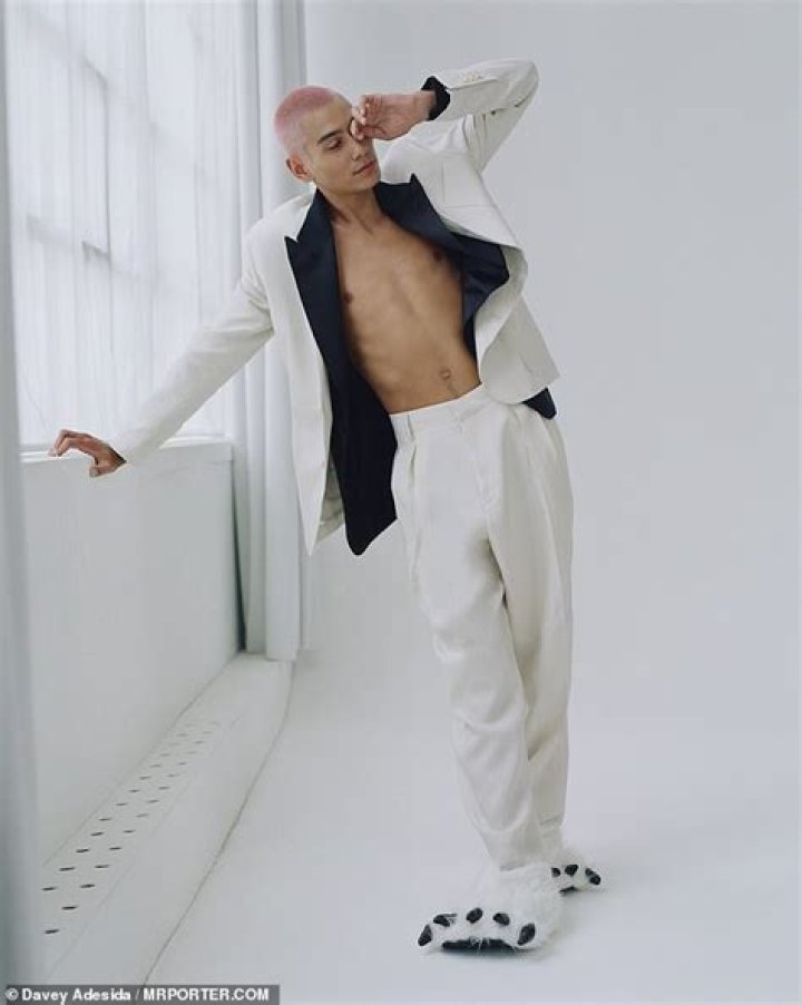 Bit sleepy? One edgy shot saw Evan leaning on a windowsill and flashing his shirtless chest while donning fluffy, white slippers