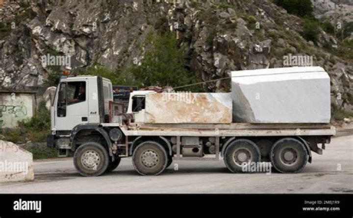 Trucks move marble blocks at a marble quarry in Carrara, Italy, on Thursday, Nov. 15, 2018.